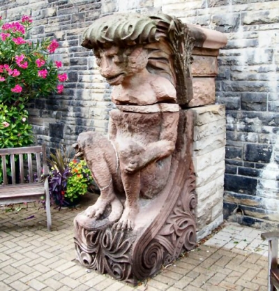 a Casa Loma Gargoyle in the flower garden terrace